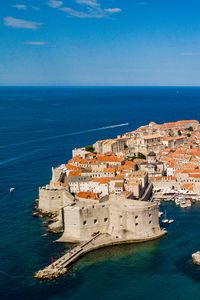 Preview wallpaper island, city, old, roofs, sea, aerial view