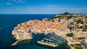 Preview wallpaper island, city, old, roofs, sea, aerial view