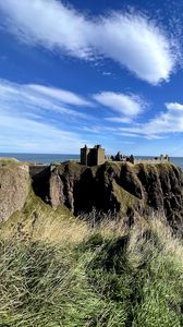Preview wallpaper island, cliff, building, fortress, grass, sea