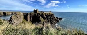 Preview wallpaper island, cliff, building, fortress, grass, sea