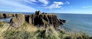 Preview wallpaper island, cliff, building, fortress, grass, sea