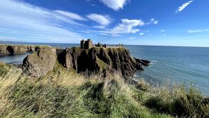 Preview wallpaper island, cliff, building, fortress, grass, sea