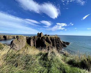 Preview wallpaper island, cliff, building, fortress, grass, sea