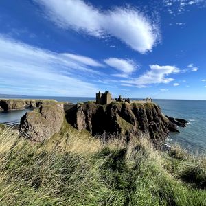 Preview wallpaper island, cliff, building, fortress, grass, sea