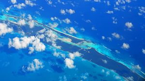 Preview wallpaper island, clouds, sea, aerial view, blue