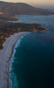 Preview wallpaper island, coast, sea, city, evening