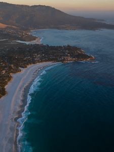 Preview wallpaper island, coast, sea, city, evening