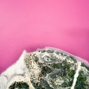 Preview wallpaper island, coast, sea, pink, aerial view