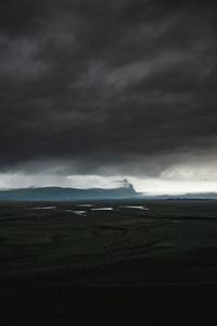 Preview wallpaper island, dark, clouds, iceland