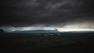 Preview wallpaper island, dark, clouds, iceland
