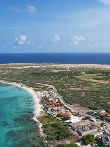 Preview wallpaper island, houses, buildings, coast, sea