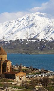 Preview wallpaper island, lake, mountains, water, structure, coast