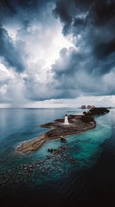 Preview wallpaper island, lighthouse, sea, clouds, landscape