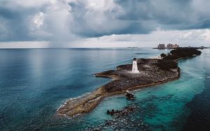 Preview wallpaper island, lighthouse, sea, clouds, landscape