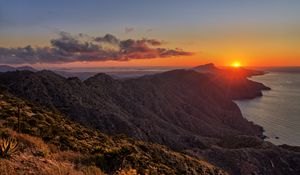 Preview wallpaper island, mountains, sea, sunset, dusk