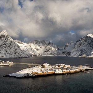 Preview wallpaper island, mountains, snow, sea, houses