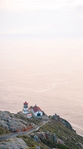 Preview wallpaper island, rock, ocean, lighthouse, twilight
