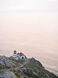 Preview wallpaper island, rock, ocean, lighthouse, twilight