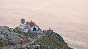 Preview wallpaper island, rock, ocean, lighthouse, twilight