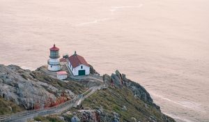 Preview wallpaper island, rock, ocean, lighthouse, twilight