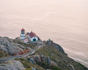 Preview wallpaper island, rock, ocean, lighthouse, twilight