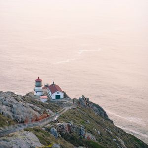 Preview wallpaper island, rock, ocean, lighthouse, twilight