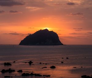 Preview wallpaper island, rock, sunset, sea, dusk, landscape