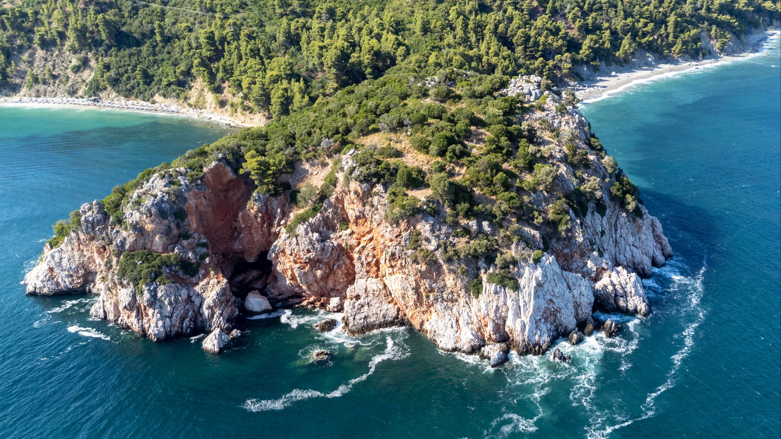 Download wallpaper 2560x1440 island, rocks, sea, waves, aerial view