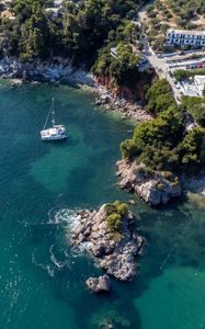 Preview wallpaper island, rocks, sea, water, boat, aerial view