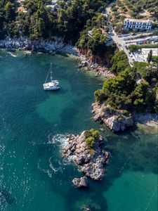 Preview wallpaper island, rocks, sea, water, boat, aerial view