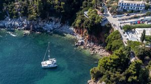 Preview wallpaper island, rocks, sea, water, boat, aerial view