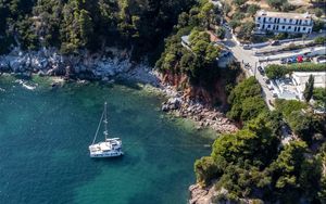 Preview wallpaper island, rocks, sea, water, boat, aerial view