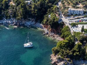 Preview wallpaper island, rocks, sea, water, boat, aerial view