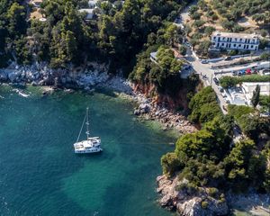 Preview wallpaper island, rocks, sea, water, boat, aerial view