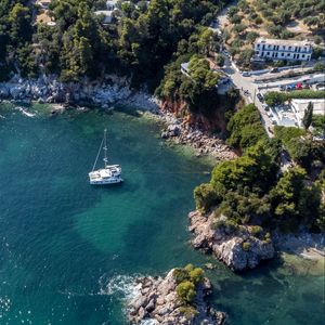 Preview wallpaper island, rocks, sea, water, boat, aerial view