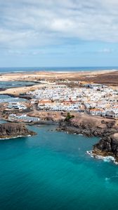 Preview wallpaper island, sea, buildings, aerial view