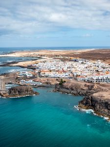 Preview wallpaper island, sea, buildings, aerial view