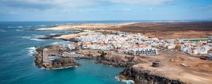 Preview wallpaper island, sea, buildings, aerial view