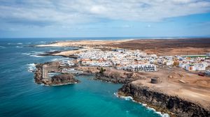 Preview wallpaper island, sea, buildings, aerial view