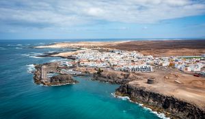 Preview wallpaper island, sea, buildings, aerial view