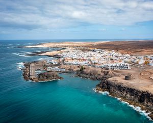 Preview wallpaper island, sea, buildings, aerial view