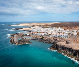 Preview wallpaper island, sea, buildings, aerial view