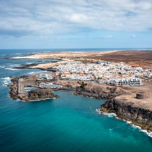 Preview wallpaper island, sea, buildings, aerial view