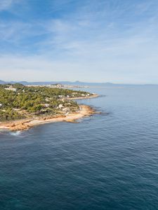 Preview wallpaper island, sea, trees, buildings, sky, nature