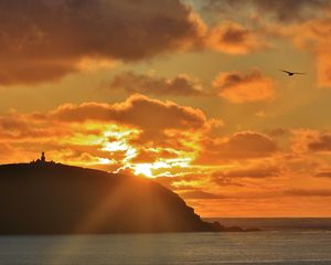 Preview wallpaper island, sunset, clouds, landscape, dark