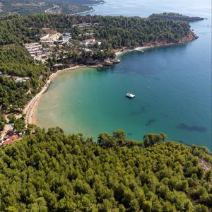 Preview wallpaper island, trees, sea, boat, aerial view