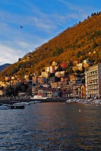 Preview wallpaper italy, lombardy, como, sea, promenade, pier, houses, mountains, water, sky