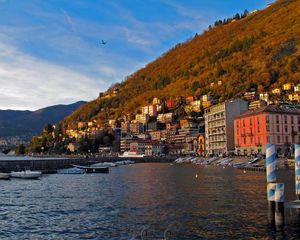 Preview wallpaper italy, lombardy, como, sea, promenade, pier, houses, mountains, water, sky