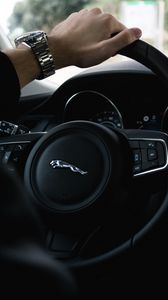 Preview wallpaper jaguar, steering wheel, hand, watch