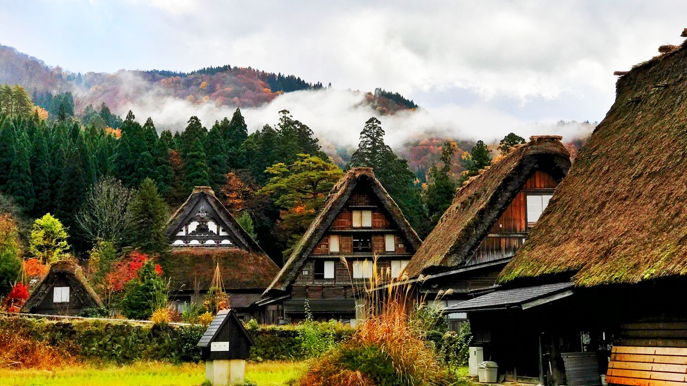 Download wallpaper 1366x768 japan, shirakawa, houses, mountains, trees  tablet, laptop hd background